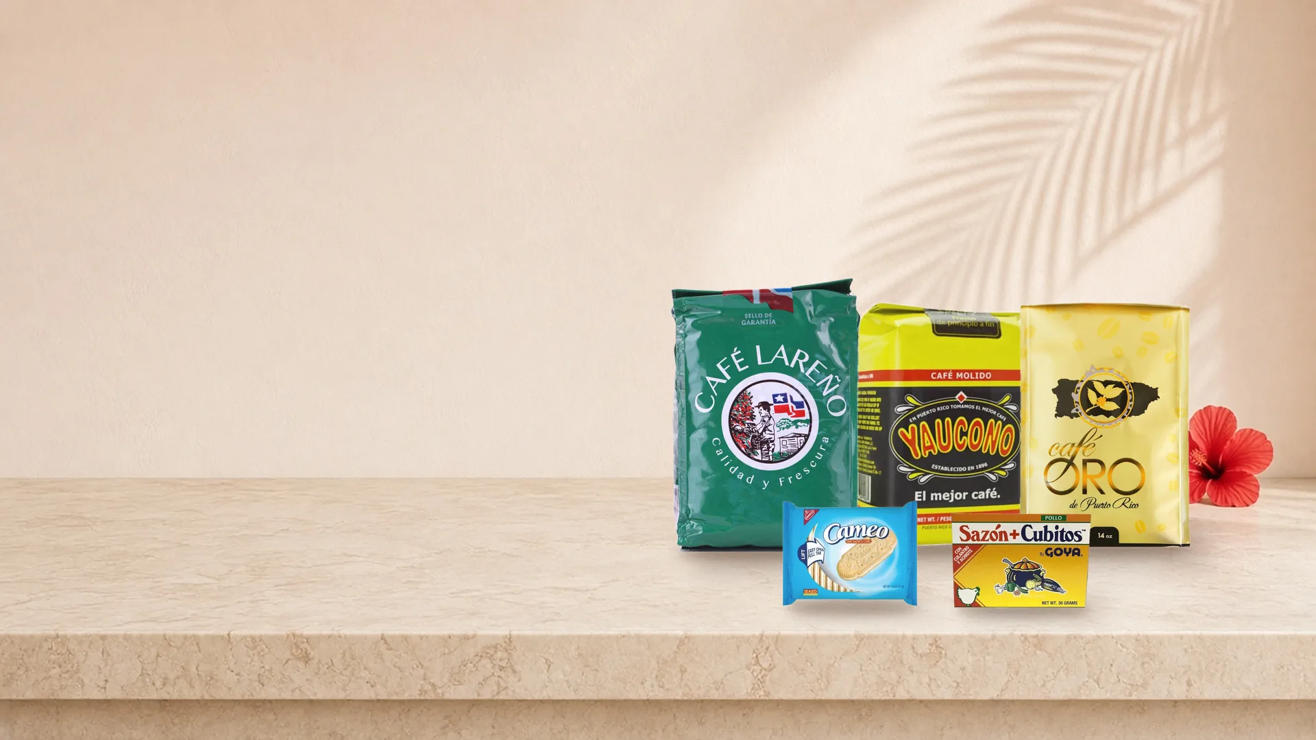 Café Lareño, Yaucono and Café Oro coffee with Cameo cookies and Goya Sazón on a kitchen counter